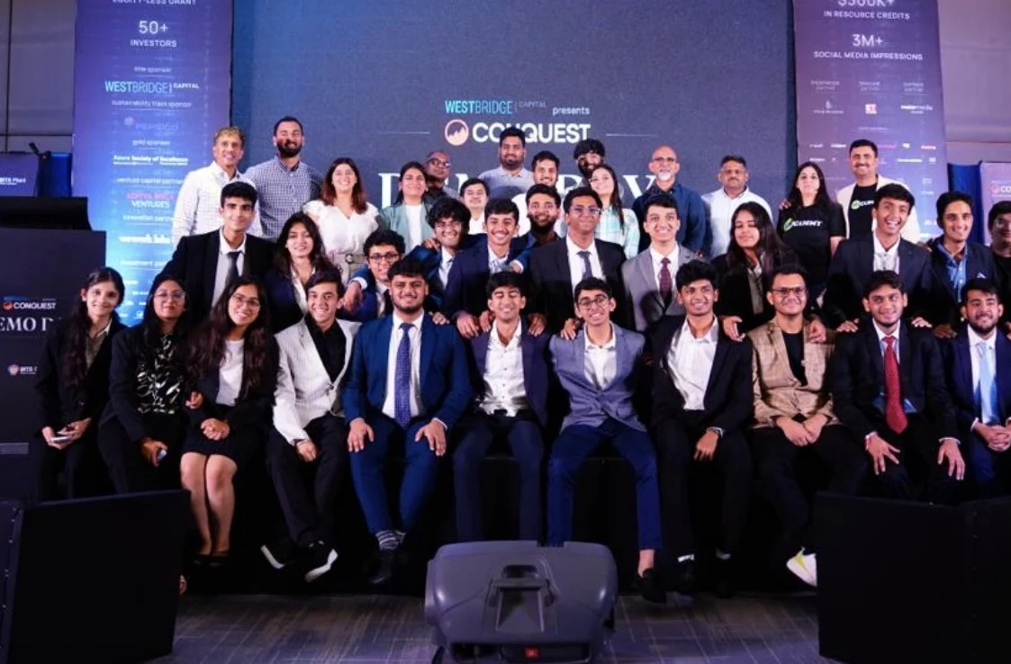 The Conquest team and startups together at the event.